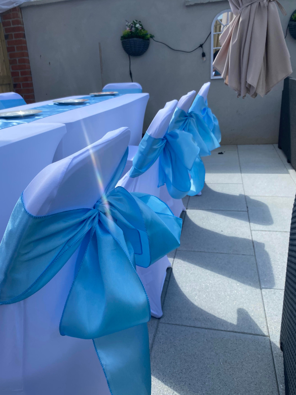 Blue Table arrangements and chair bows for hire ireland